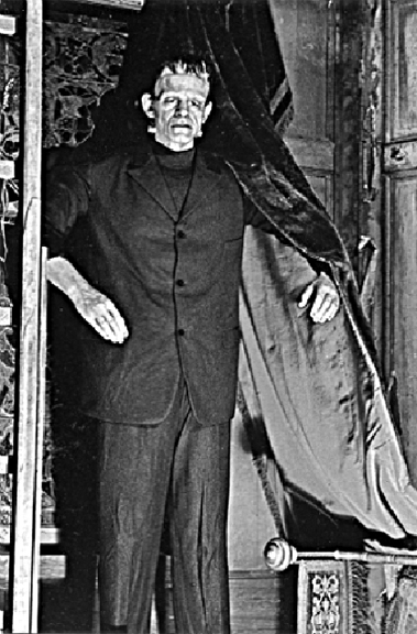 Front of postcard, black and white image of wax museum statue of Frankenstein.